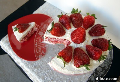 Another perspective of a single slice of the elegant French Strawberry Cake.