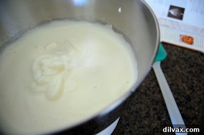Slicing the genoise cake into even layers for the French Strawberry Cake.