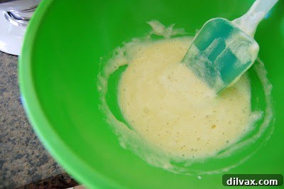 Preparing fresh strawberries for the cake filling and topping.