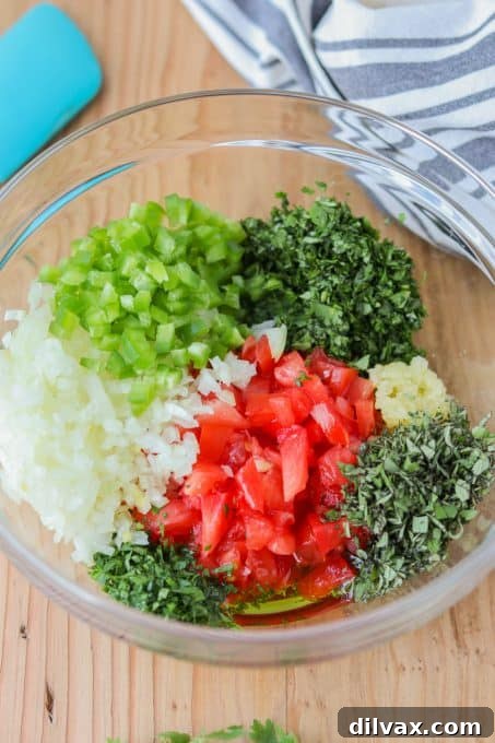 A colorful array of diced fresh tomatoes, onions, jalapeños, and herbs like oregano and cilantro.
