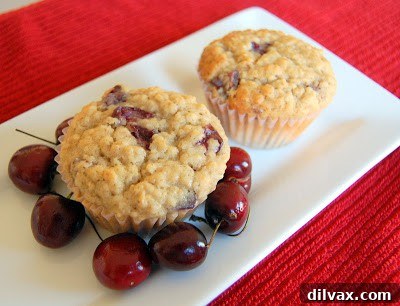 Juicy Cherry & Hearty Oat Muffins 10 Freshly baked cherry oatmeal muffins cooling on a wire rack, golden brown and perfectly risen.