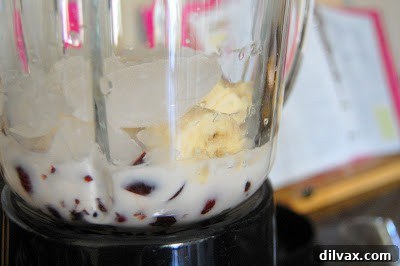 Cherry Banana Dream Smoothie Saturday 4 Close-up of a blender containing the ingredients for the Cherry Banana Bliss Smoothie.