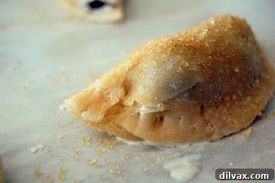 Flaky Cherry Blueberry Turnovers 13 A basket full of golden-brown cherry blueberry turnovers