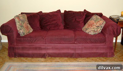 Cozy couch with blankets, representing a recovery space.