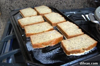 Banana Bread French Toast cooking on a griddle