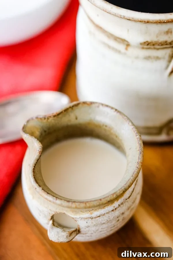 Whip Up French Vanilla Coffee Creamer 3 Homemade French Vanilla Coffee Creamer in a ceramic bottle.