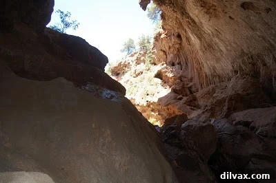 Detailed shot of the rock formations and water flow inside the bridge.