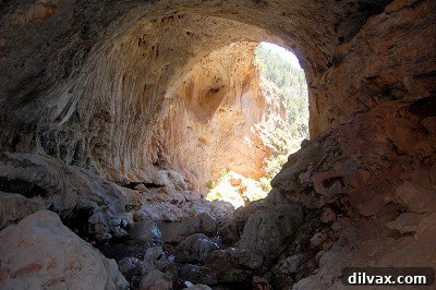 A wide shot showcasing the impressive interior of Tonto Natural Bridge, emphasizing its scale.