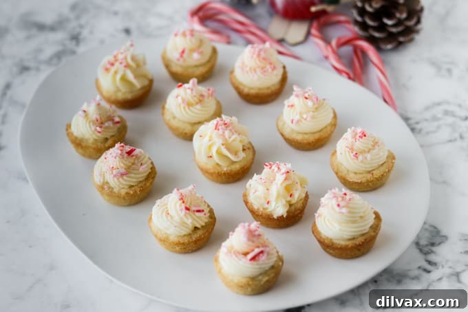 Mini Peppermint Cookie Cups 2 Buttercream frosting on top of cookie cups with crushed candy canes.