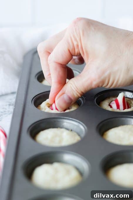 Mini Peppermint Cookie Cups 6 Pressing a candy cane kiss into cookies.