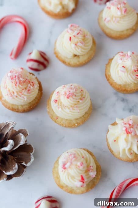Mini Peppermint Cookie Cups 10 Cookies cups with peppermint frosting and candy cane kisses.