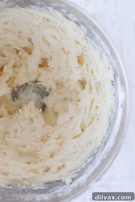 Whipped Peppermint Bliss 5 Smooth and fluffy Peppermint frosting spread on a surface, highlighting its vibrant color.