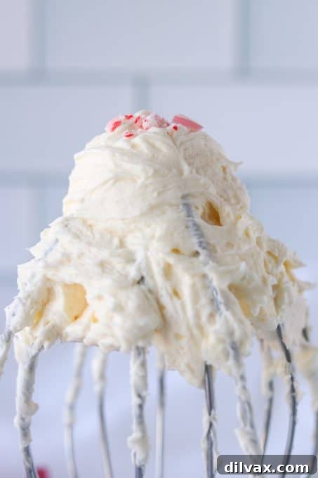 Creamy peppermint buttercream frosting with a piping bag