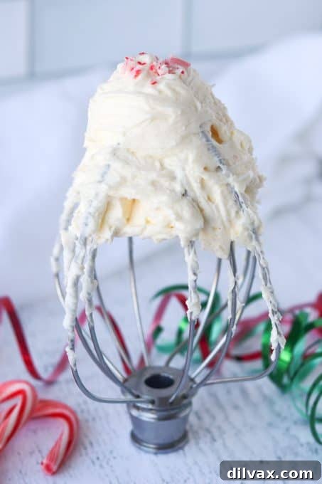 Peppermint buttercream frosting with festive candy cane pieces