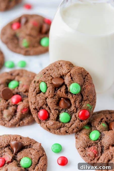 Our 12 Sweetest Days of 2021 6 Festive Double Chocolate M&M Christmas Cookies, adorned with red and green candies.