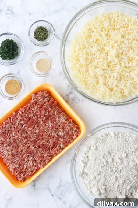 Cheesy Sausage Poppers 4 Essential ingredients laid out for making easy Bisquick appetizers.