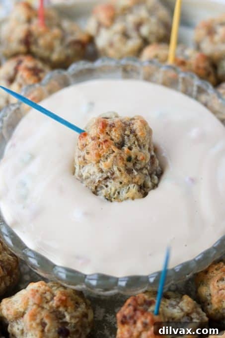 A perfectly golden-brown sausage and cheese appetizer, ready to be enjoyed.