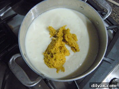 Finished butternut squash risotto in a saucepan, ready to be served.