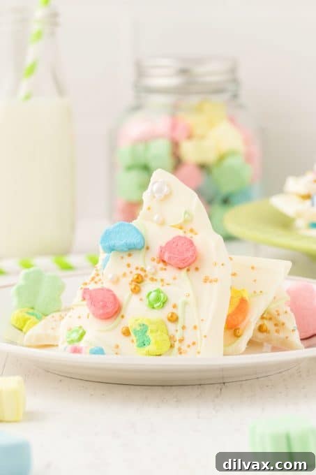 Rainbow Magic Bark 3 A festive close-up of Lucky Charms Bark with green and white chocolate swirls.