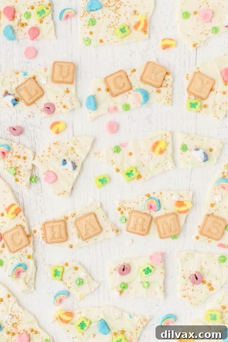 Rainbow Magic Bark 7 Close-up of pieces of white chocolate bark with Lucky Charms cereal.
