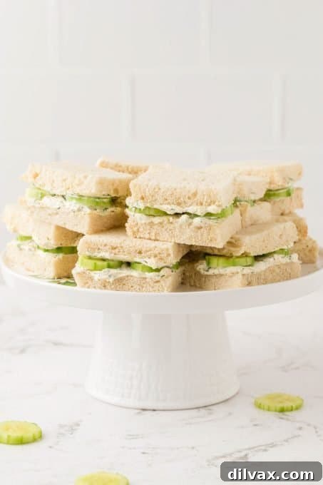 Elegant Cucumber Bites 7 A plate of cucumber and seasoned cream cheese sandwiches ready to serve