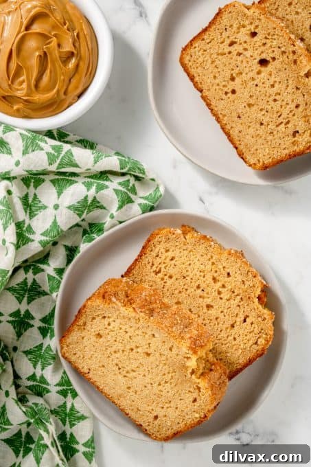 Golden Peanut Butter Quick Bread 3 Close-up of a slice of Peanut Butter Bread, revealing its moist crumb and rich texture.