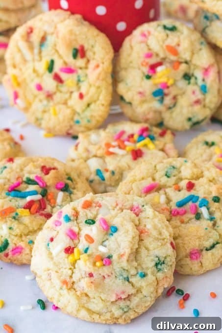 Close-up of a stack of fluffy Funfetti Cookies, showcasing their soft texture and abundant sprinkles.