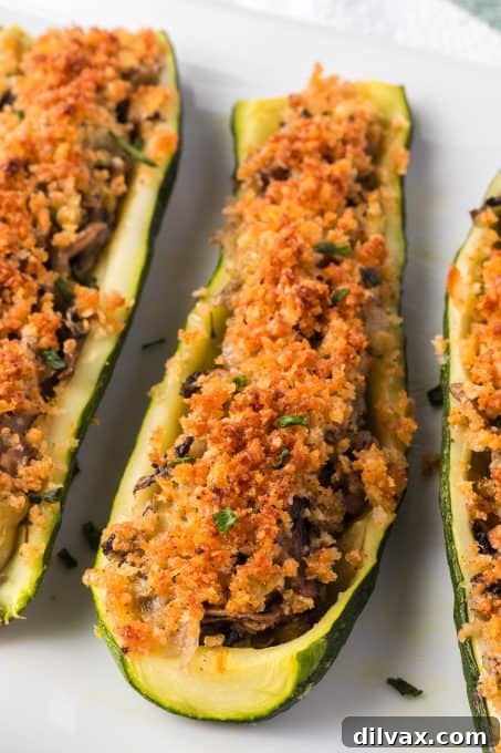 Savory Mushroom Onion Zucchini Boats 9 An easy and inviting plate of stuffed zucchini, perfect for a healthy meal.