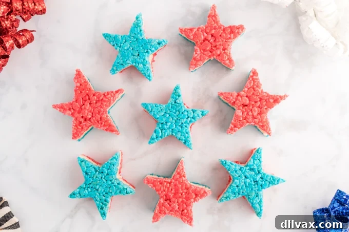 4th of July Krispie Treat Stars - A vibrant red, white, and blue layered dessert perfect for patriotic holidays.
