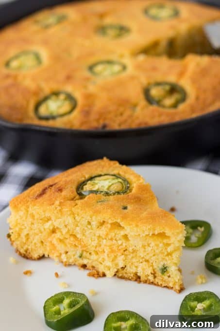 Skillet Jalapeño Cornbread ready to be served, showing the golden top and embedded jalapeño slices.