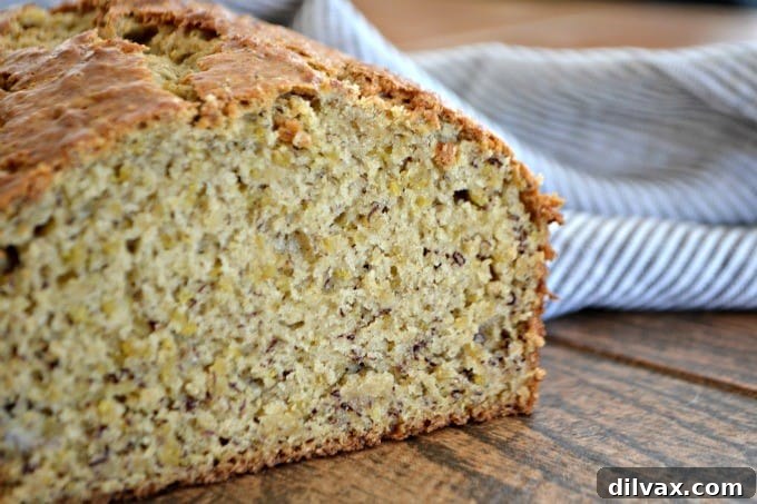Superfood Quinoa Banana Bread 2 Delicious and moist Quinoa Banana Bread loaf, ready to be sliced, offering a healthy twist on a classic comfort food.