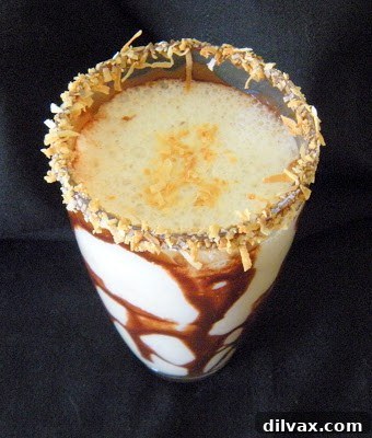 Detail shot of a glass rim being dipped in chocolate sauce