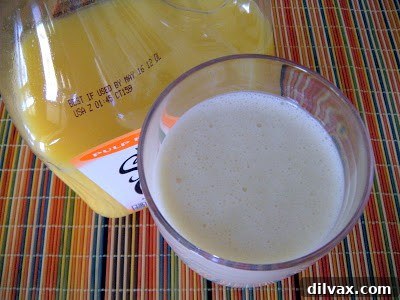 Ingredients for an Orange Dream Smoothie laid out, including oranges, yogurt, and honey.