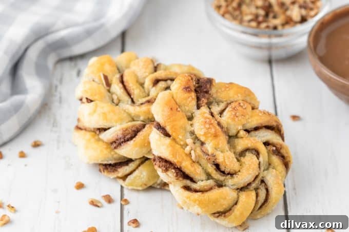 Decadent Nutella Twists 2 Golden Nutella Knots on a baking sheet