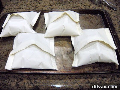 Cooked Parchment Bake Tilapia fillet still in its sealed parchment bag