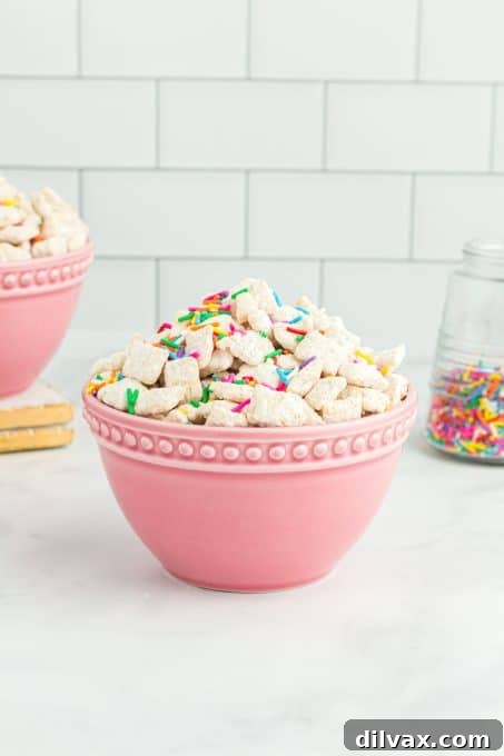 Simple Funfetti Snack Mix 7 A large bowl filled with colorful Funfetti Muddy Buddies.