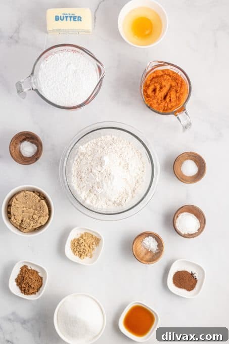 Fresh ingredients laid out for making pumpkin crinkles, including flour, sugars, spices, and a can of pumpkin puree.