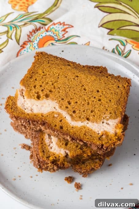 Pumpkin Cheesecake Bread 3 Close-up shot of a whole loaf of Cream Cheese Pumpkin Bread, showcasing the golden-brown crust.