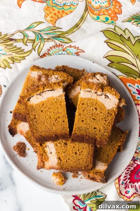 Pumpkin Cheesecake Bread 6 Freshly baked Pumpkin quick bread with a subtle cream cheese swirl visible on top.