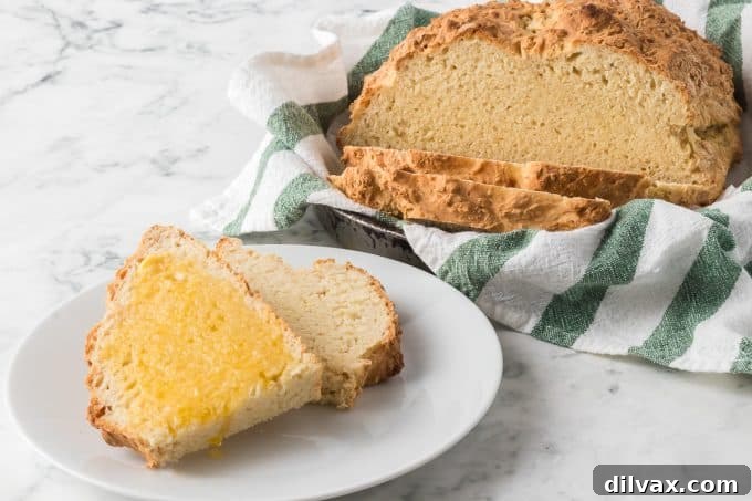 Emerald Isle's Easiest Soda Bread 2 Freshly baked traditional Irish Soda Bread with a signature cross on top, golden brown and rustic