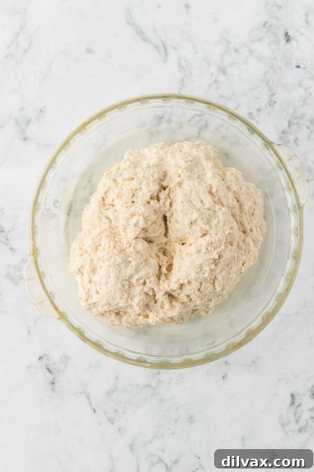 Emerald Isle's Easiest Soda Bread 6 A serrated knife cutting the traditional cross into the top of Irish Soda Bread dough before baking