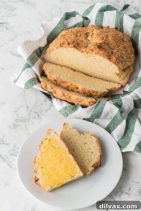 Emerald Isle's Easiest Soda Bread 8 Close-up of a rustic loaf of Irish Soda Bread, highlighting its simple four-ingredient composition and no-yeast baking method
