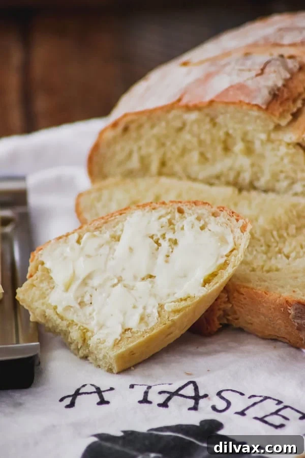 A buttered slice of Grandma's Italian Bread.