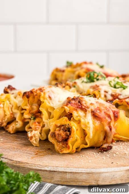 Hand holding a Lasagna Pasta Skewer, highlighting its finger-food appeal.