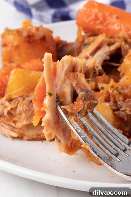 A bite of Spare Ribs made in the slow cooker.