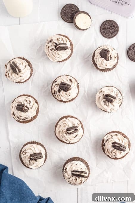 A beautifully arranged table full of homemade chocolate Oreo cupcakes, ready to be enjoyed.