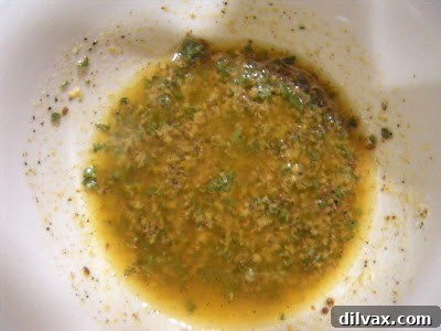 Whisking ingredients for the mustard rub in a small bowl.