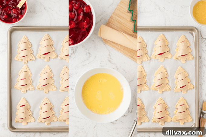 The final step of preparing Christmas Cherry Hand Pies, showing them brushed with egg wash and sprinkled with coarse sanding sugar before baking.