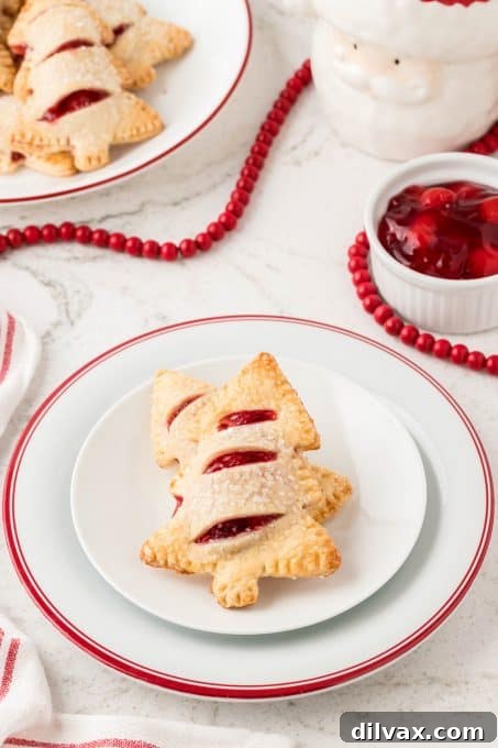 A stack of perfectly baked Christmas Cherry Hand Pies, ready to be enjoyed.