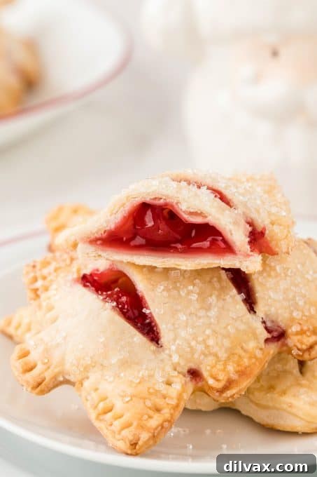 A festive array of Christmas Cherry Hand Pies, beautifully arranged on a serving platter.